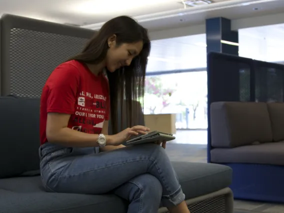 Student reading on tablet