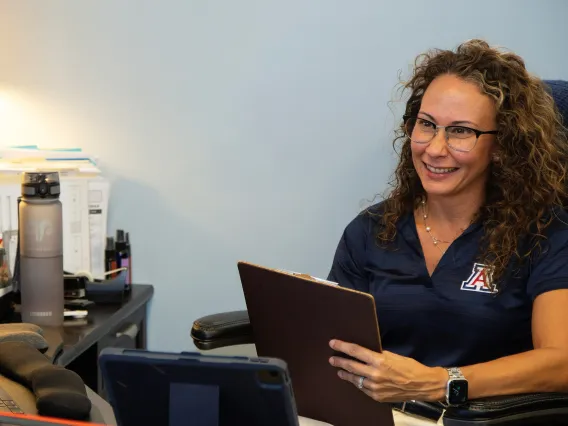 Dr. Vasquez working with a student