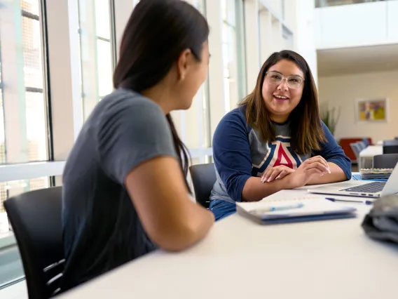 Tutor teaching student