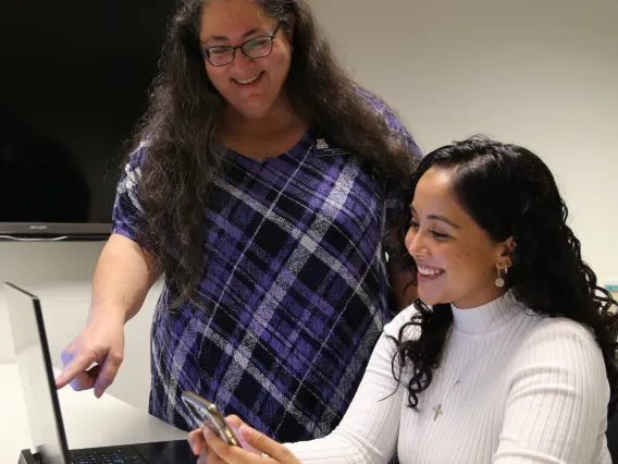 Specialist showing tips on laptop