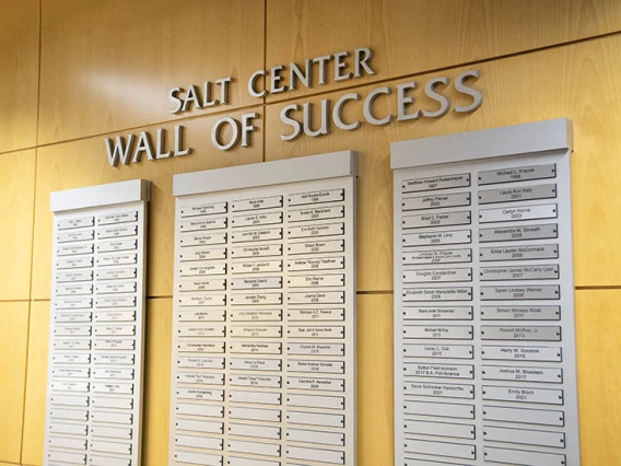 Alumni names displayed on plaques. Text above which reads "SALT CENTER WALL OF SUCCESS"