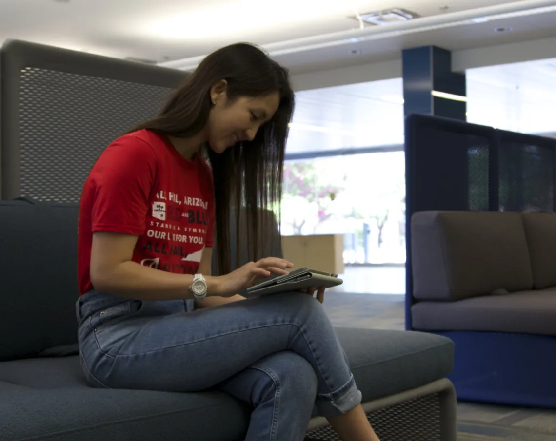 Student reading on tablet