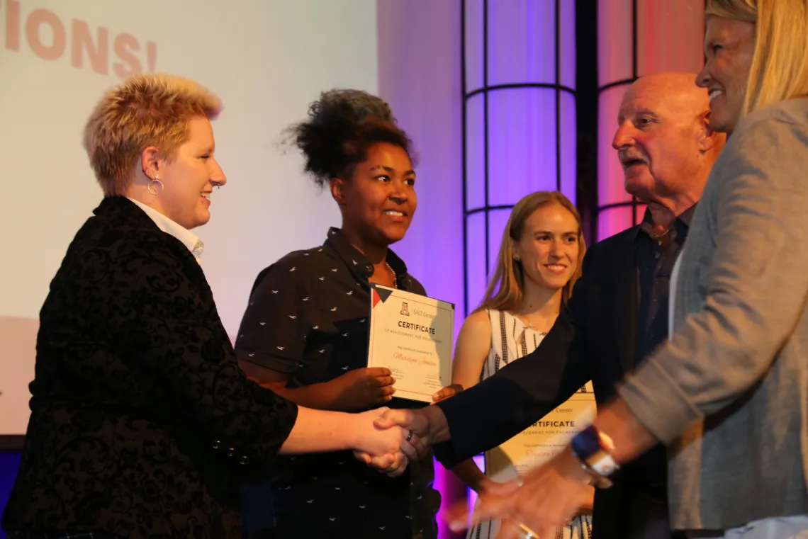 Award recipients shaking hands on stage