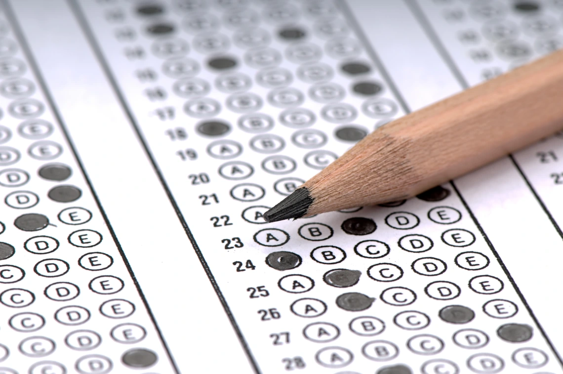 Pencil resting on a bubble sheet exam