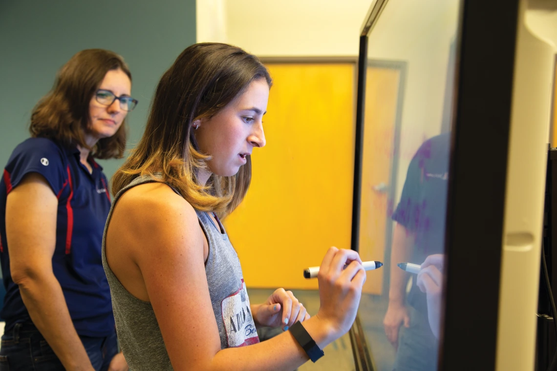 Mary Beth with a Student