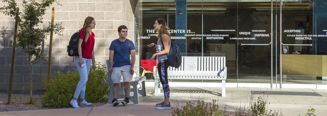 A group of students talking in front of the SALT Center