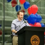 Man speaking into a podium microphone