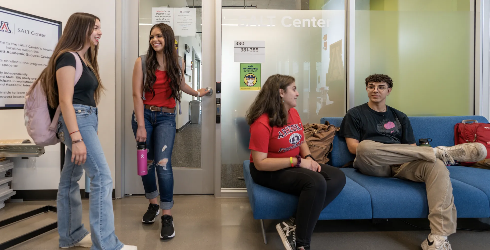 4 students outside of the SALT Center at the Bartlett Academic Success Center. 