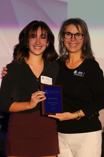Mari White receiving her award