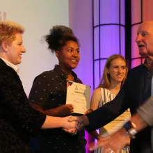 Award recipients shaking hands on stage