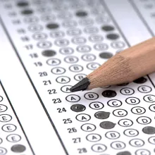 Pencil resting on a bubble sheet exam