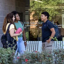 3 students chatting outside the SALT Center